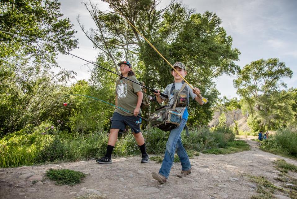 two children walking to go fishing at gypsum ponds