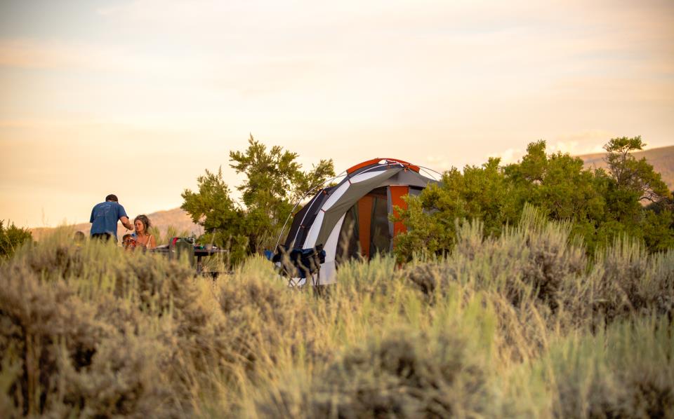 people tent camping at sunset at the gypsum town camp ground