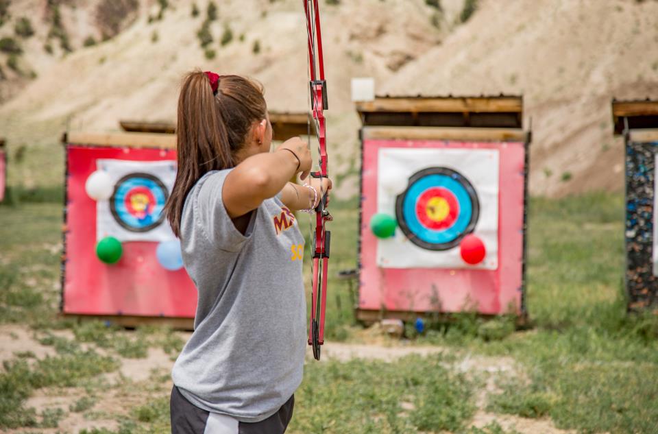 person shooting bow at gypsum archery park