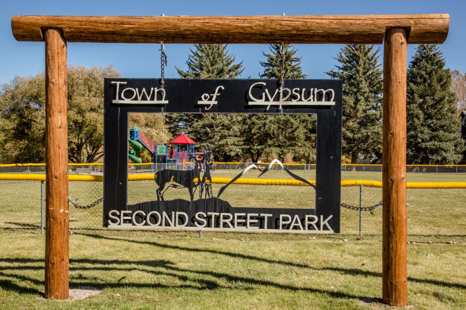 Gypsum Second Street Park entrance sign with playground in background